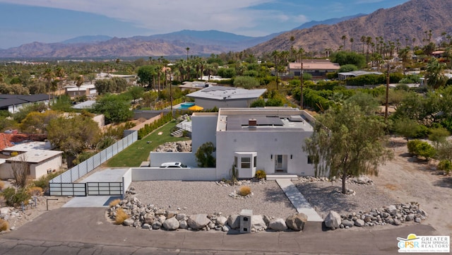 birds eye view of property featuring a mountain view