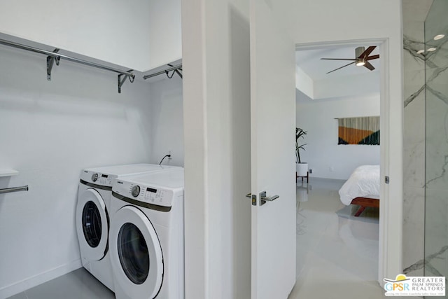 laundry room featuring washing machine and clothes dryer and ceiling fan