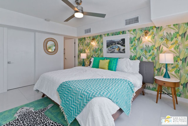 tiled bedroom with ceiling fan