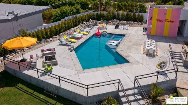 view of swimming pool with a patio