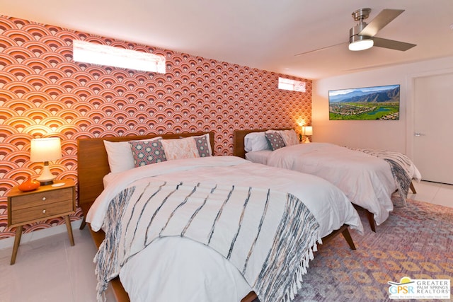 bedroom with tile patterned flooring and ceiling fan