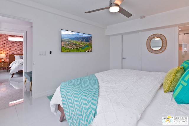 bedroom with tile patterned floors and ceiling fan