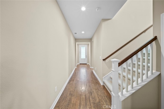 corridor featuring hardwood / wood-style floors