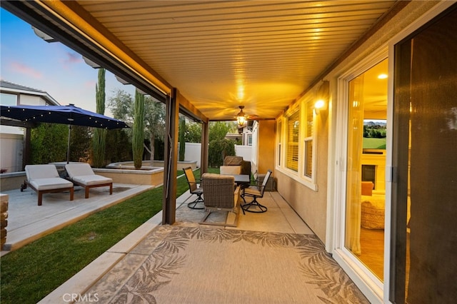 view of patio terrace at dusk