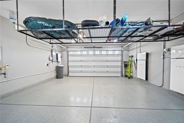 garage featuring white fridge