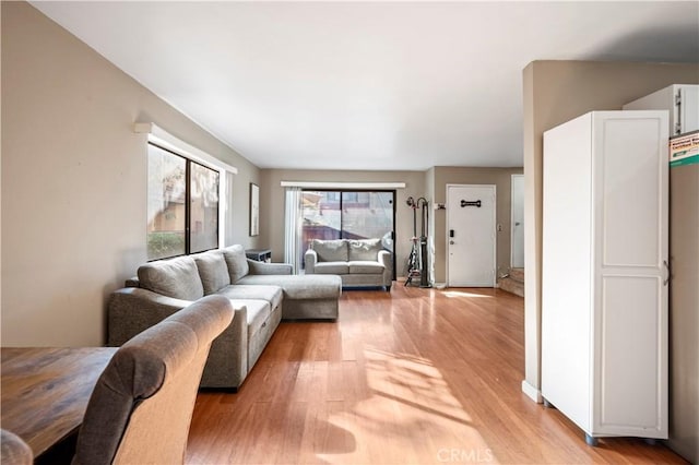 living room with light hardwood / wood-style flooring