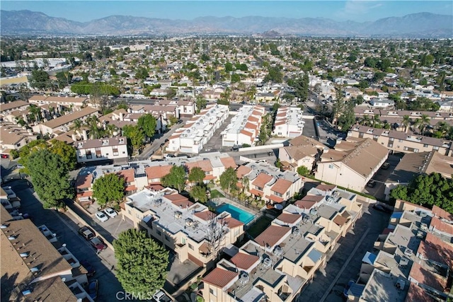 birds eye view of property with a mountain view