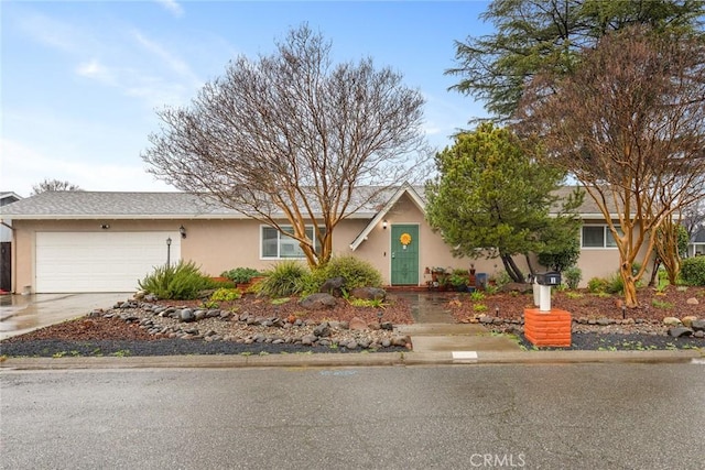 single story home featuring a garage