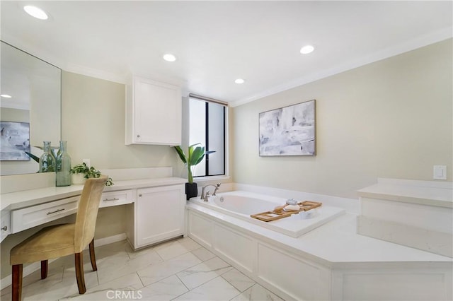 bathroom featuring crown molding, vanity, and a bathtub