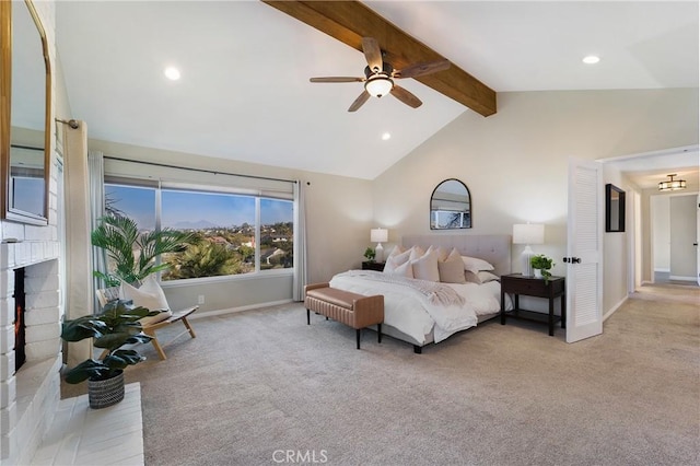 carpeted bedroom with lofted ceiling with beams, a brick fireplace, and ceiling fan