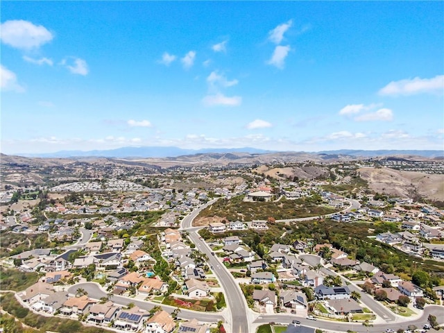 drone / aerial view featuring a mountain view