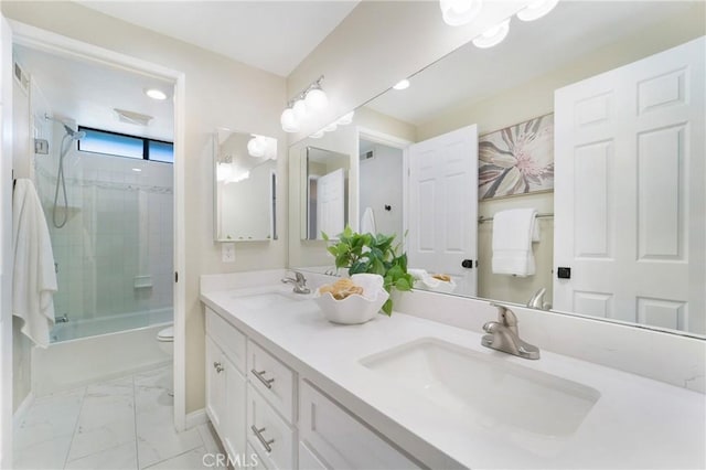 full bathroom featuring tiled shower / bath combo, vanity, and toilet