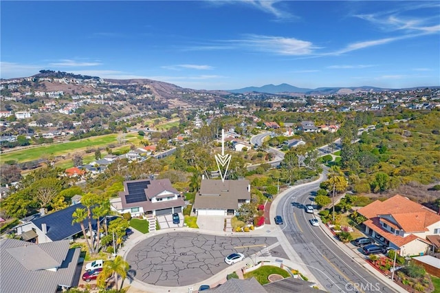 birds eye view of property featuring a mountain view