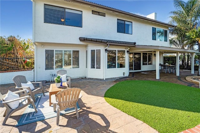 rear view of property with a patio area