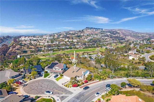 birds eye view of property with a mountain view