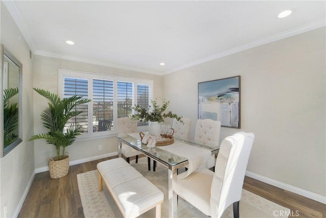 dining space with crown molding and dark hardwood / wood-style floors