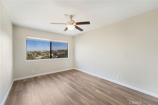 unfurnished room with ceiling fan and light hardwood / wood-style floors