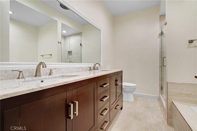 bathroom with walk in shower, tile patterned floors, vanity, and toilet