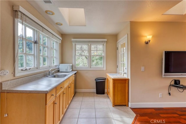 kitchen with light tile patterned flooring and sink