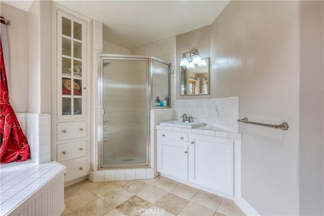 bathroom with tasteful backsplash, vanity, and an enclosed shower