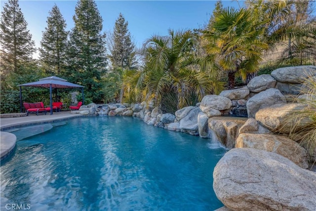 view of swimming pool featuring a gazebo