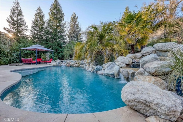 view of pool with a gazebo and a patio