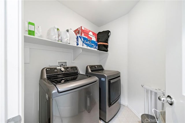 clothes washing area with washer and dryer