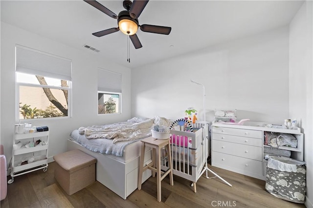 bedroom featuring ceiling fan and wood-type flooring