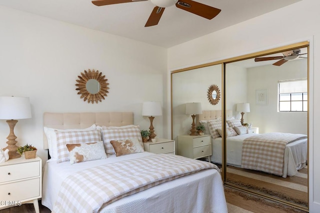 bedroom featuring ceiling fan and a closet