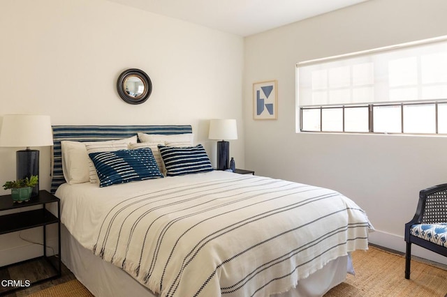 bedroom with hardwood / wood-style floors