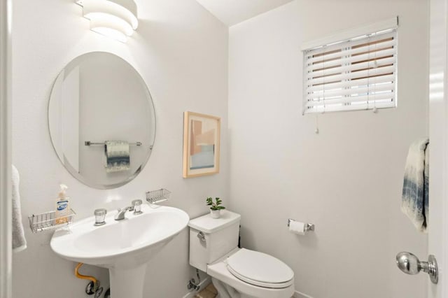 bathroom featuring toilet and sink