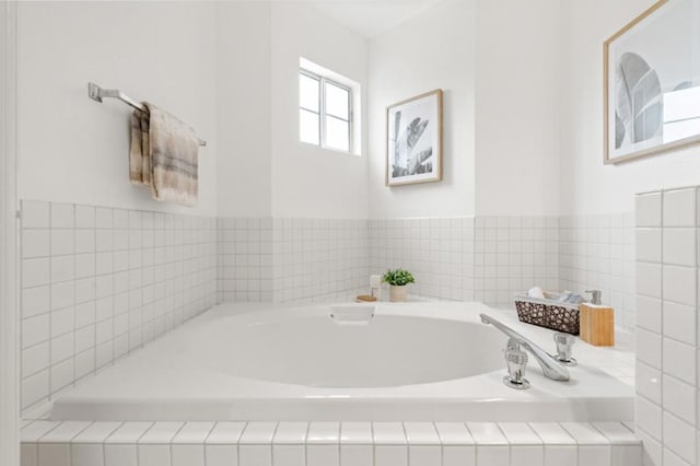 bathroom with tiled tub