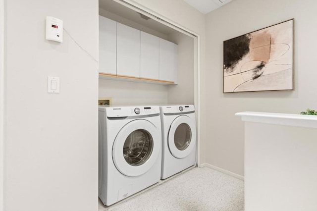 laundry area featuring cabinets and washer and dryer