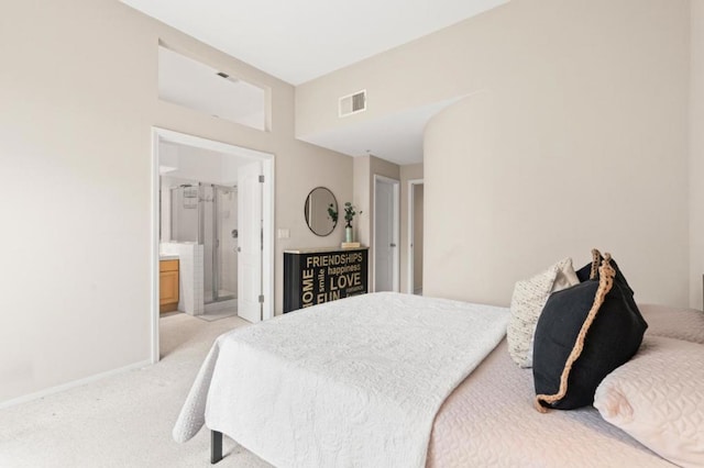 carpeted bedroom featuring connected bathroom