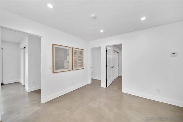 spare room featuring concrete floors