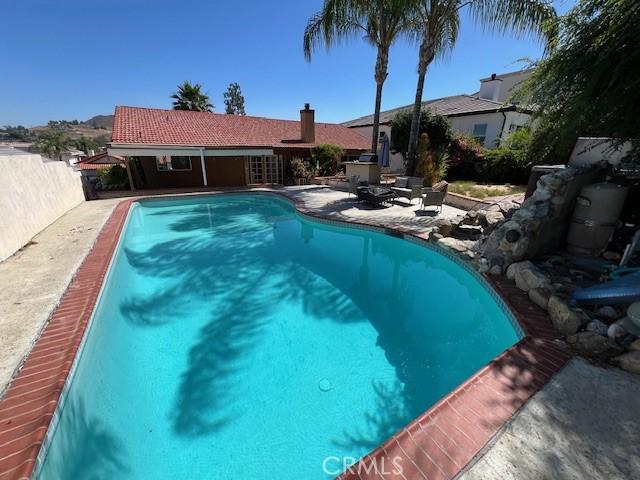 view of pool featuring a patio area