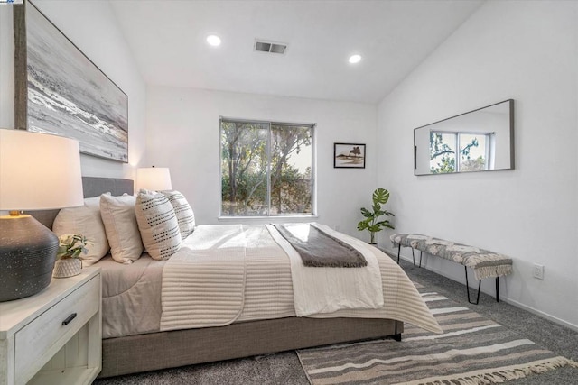 bedroom with lofted ceiling and carpet floors