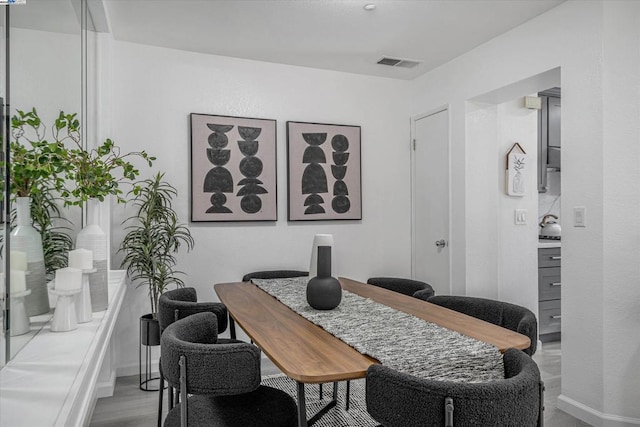 dining room with light hardwood / wood-style floors