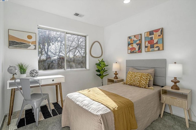 bedroom featuring light carpet