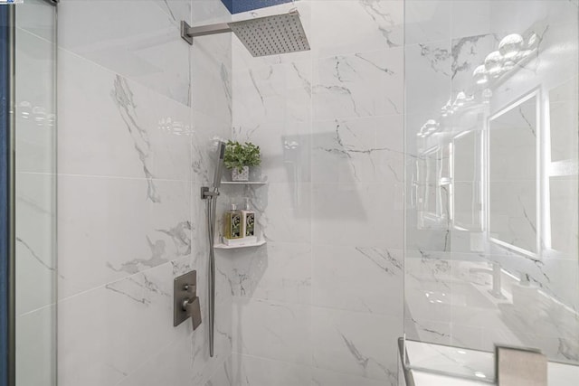 bathroom with a tile shower