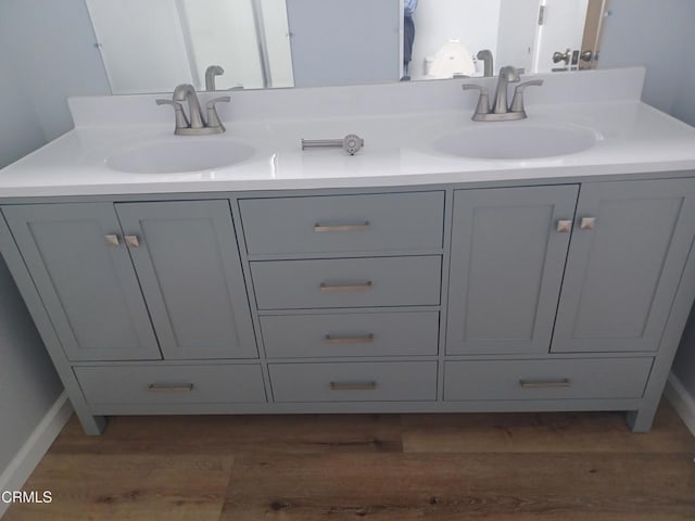 bathroom featuring vanity and hardwood / wood-style floors