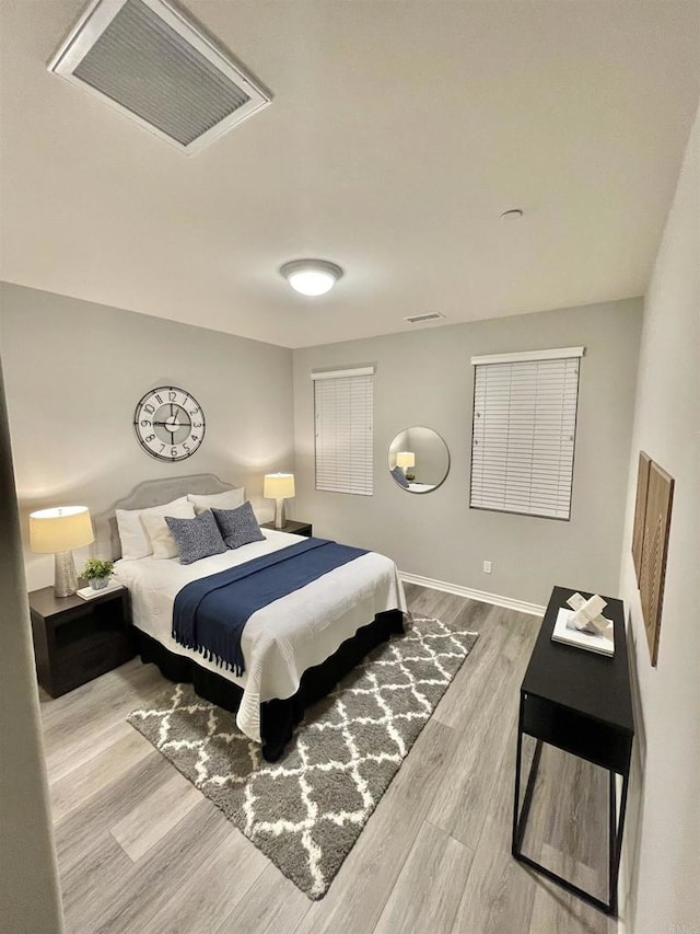 bedroom featuring wood-type flooring