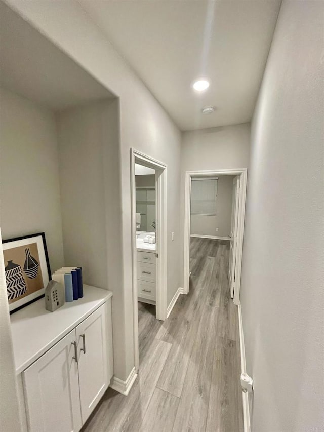 hallway featuring light wood-type flooring