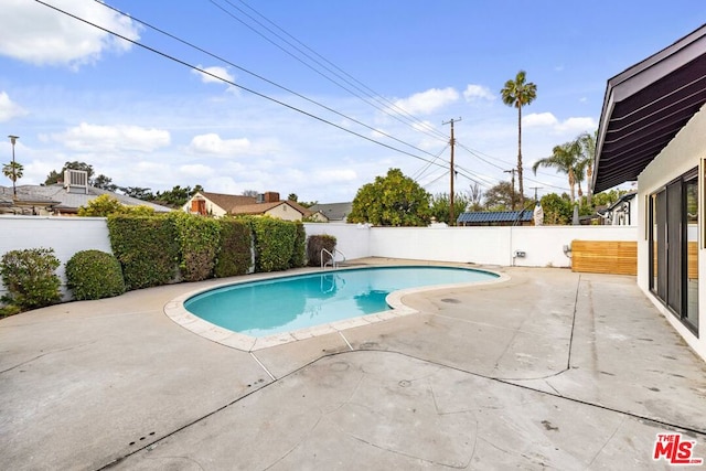 view of pool featuring a patio