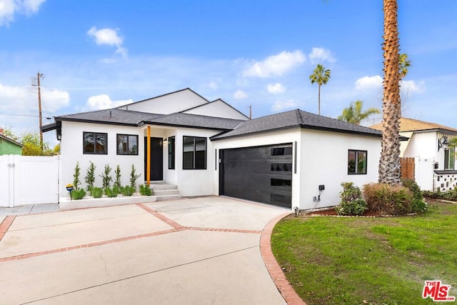 prairie-style house with a garage and a front yard