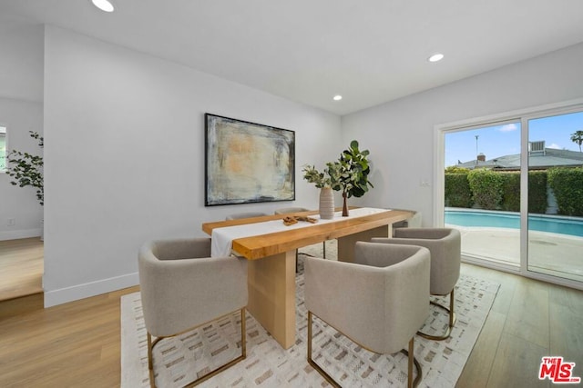 dining space featuring light hardwood / wood-style flooring