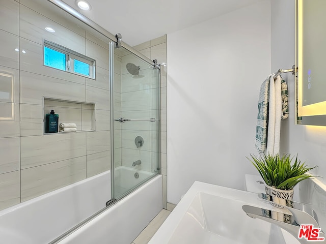 bathroom featuring enclosed tub / shower combo