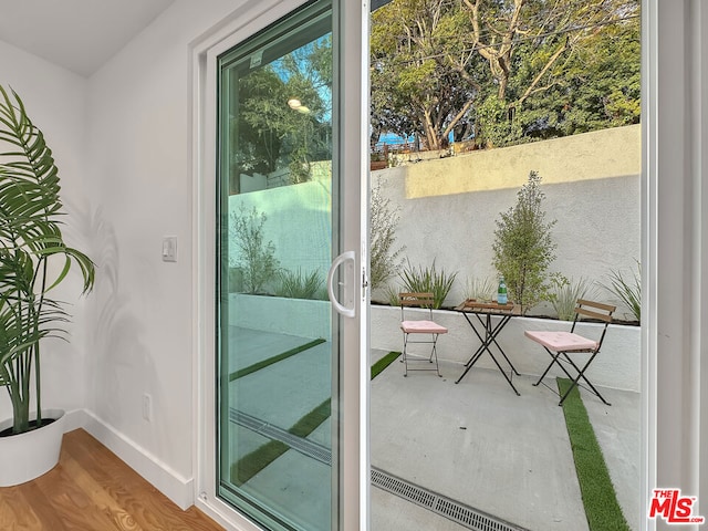 doorway featuring hardwood / wood-style flooring