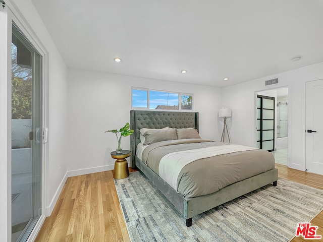 bedroom featuring light wood-type flooring