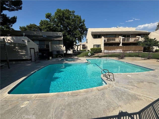 view of swimming pool with a patio